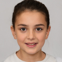 Joyful white child female with short  brown hair and brown eyes