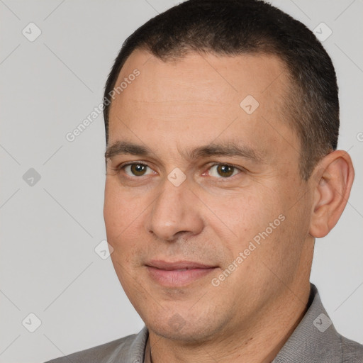 Joyful white adult male with short  brown hair and brown eyes