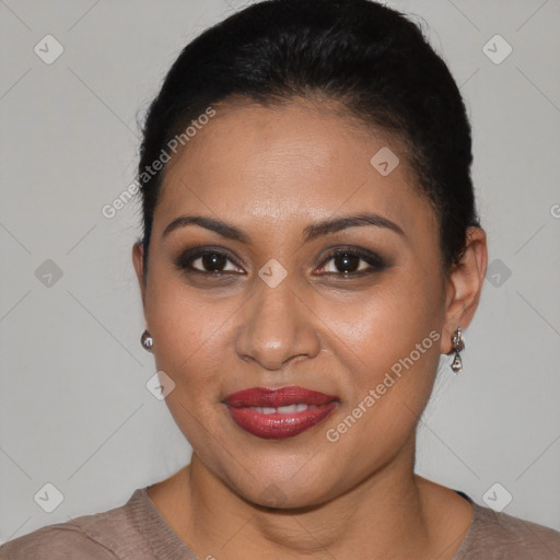 Joyful latino young-adult female with short  brown hair and brown eyes