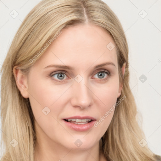 Joyful white young-adult female with long  brown hair and blue eyes