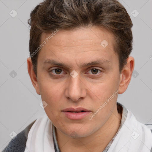 Joyful white adult male with short  brown hair and brown eyes