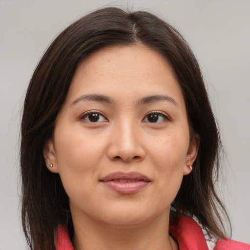 Joyful asian young-adult female with medium  brown hair and brown eyes