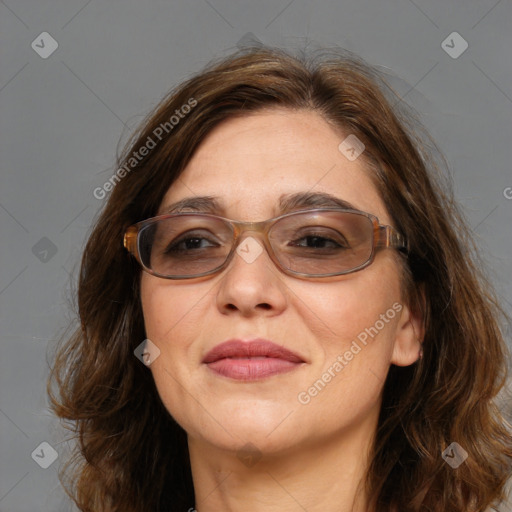 Joyful white adult female with long  brown hair and brown eyes