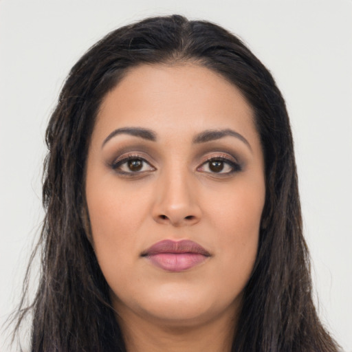 Joyful asian young-adult female with long  black hair and brown eyes