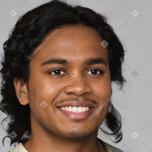 Joyful black young-adult male with short  brown hair and brown eyes