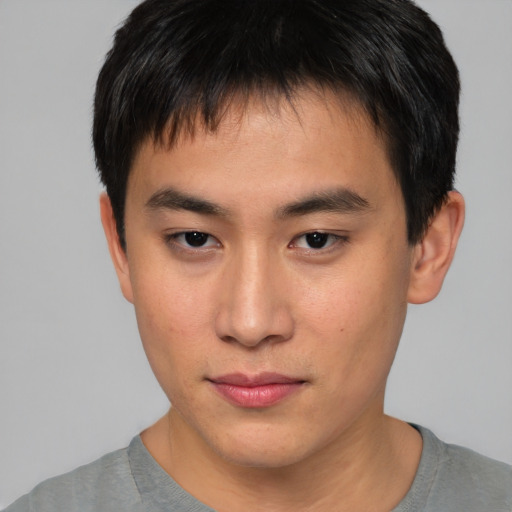 Neutral asian young-adult male with short  brown hair and brown eyes
