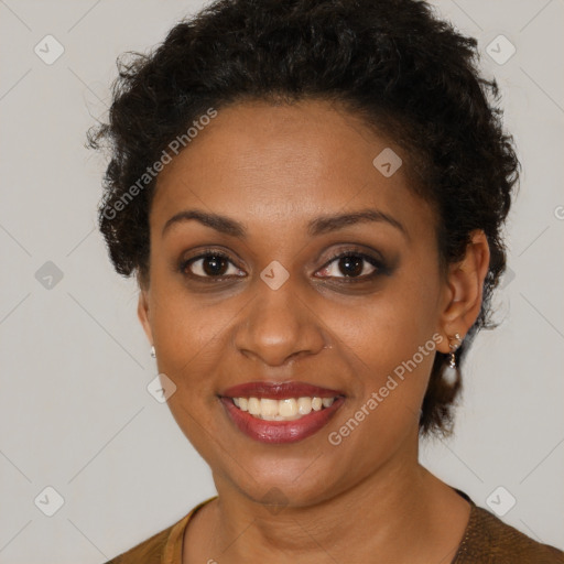 Joyful black young-adult female with short  brown hair and brown eyes