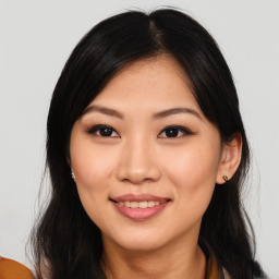 Joyful asian young-adult female with medium  black hair and brown eyes