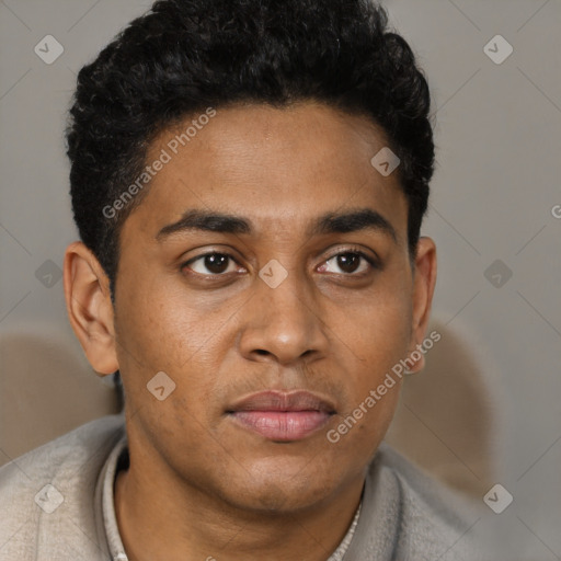 Joyful latino young-adult male with short  brown hair and brown eyes