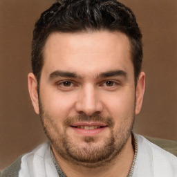 Joyful white young-adult male with short  brown hair and brown eyes