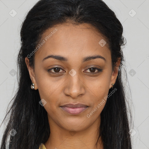 Joyful black young-adult female with long  brown hair and brown eyes