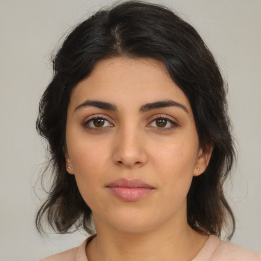 Neutral latino young-adult female with medium  brown hair and brown eyes