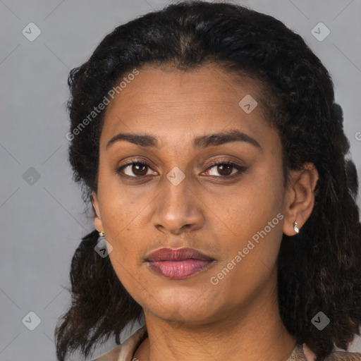 Joyful black adult female with medium  black hair and brown eyes