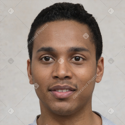 Joyful black young-adult male with short  black hair and brown eyes