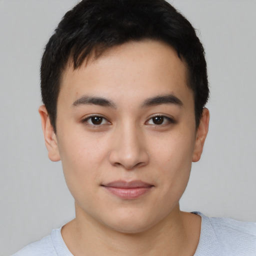 Joyful asian young-adult male with short  black hair and brown eyes