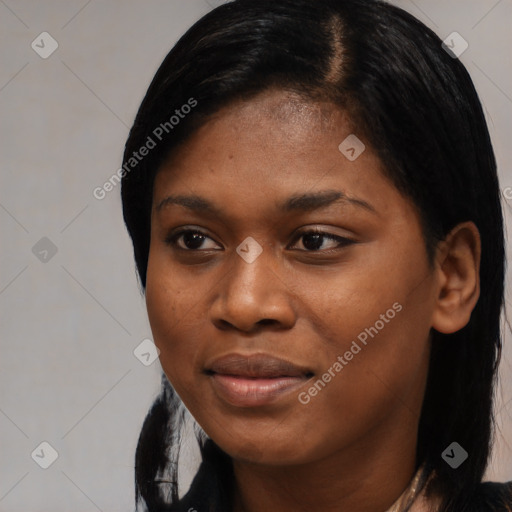 Joyful black young-adult female with short  black hair and brown eyes