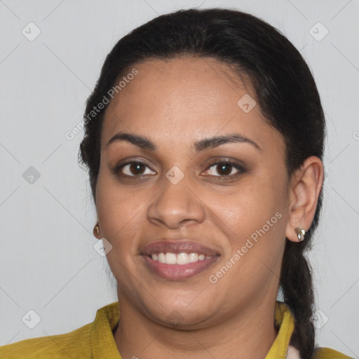 Joyful latino young-adult female with short  brown hair and brown eyes