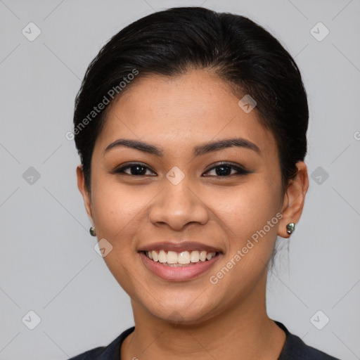 Joyful latino young-adult female with short  brown hair and brown eyes