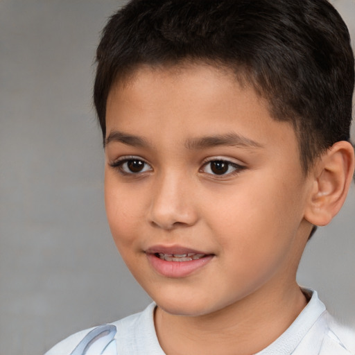 Joyful white child male with short  brown hair and brown eyes