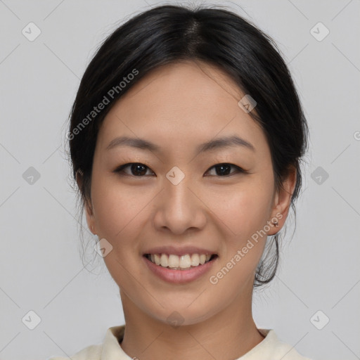 Joyful asian young-adult female with medium  black hair and brown eyes