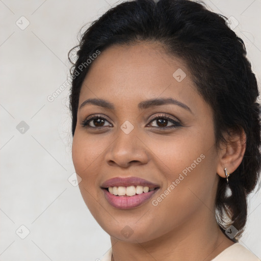 Joyful latino young-adult female with long  brown hair and brown eyes