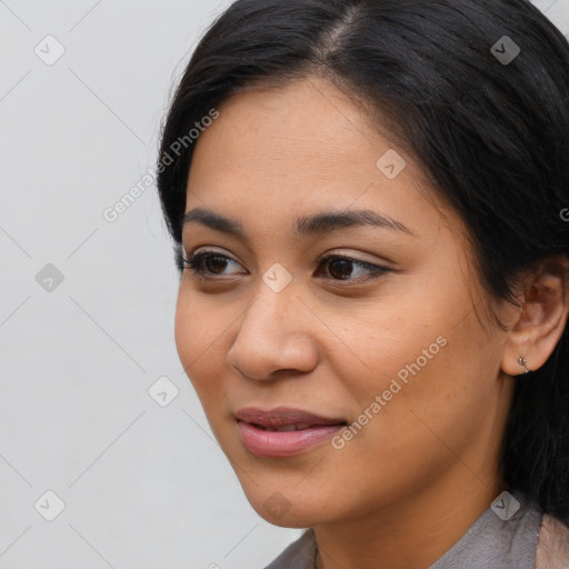 Joyful latino young-adult female with medium  black hair and brown eyes