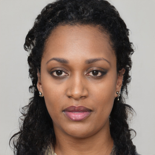 Neutral black young-adult female with long  black hair and brown eyes