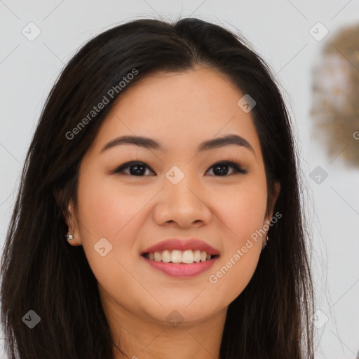 Joyful asian young-adult female with long  brown hair and brown eyes