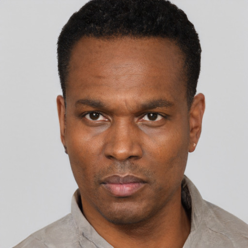 Neutral black young-adult male with short  black hair and brown eyes