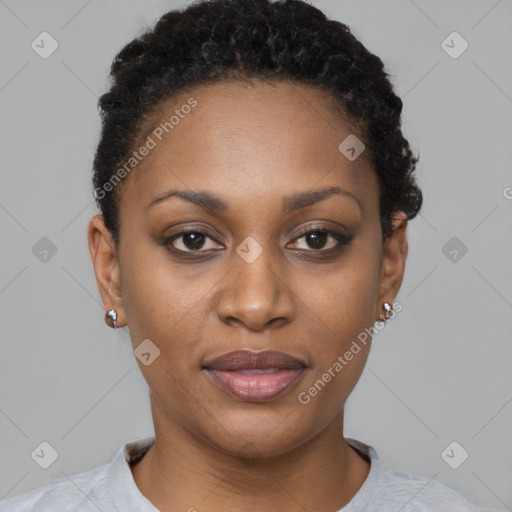 Joyful black young-adult female with short  black hair and brown eyes