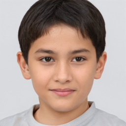 Joyful white child male with short  brown hair and brown eyes