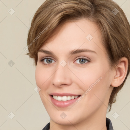 Joyful white young-adult female with medium  brown hair and grey eyes