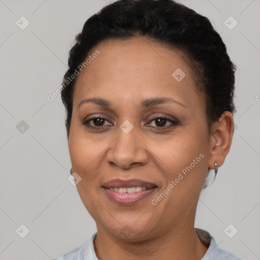 Joyful latino adult female with short  brown hair and brown eyes