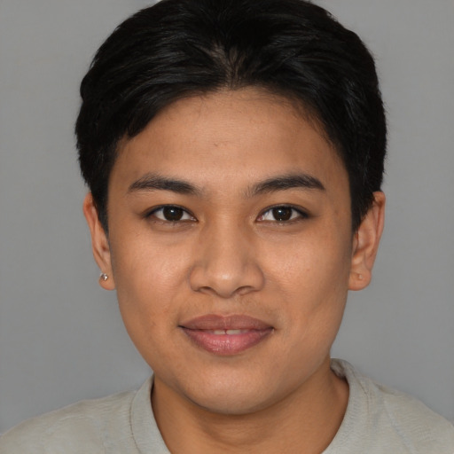Joyful asian young-adult male with short  black hair and brown eyes