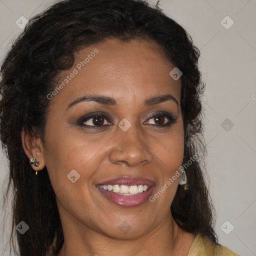 Joyful black young-adult female with long  brown hair and brown eyes