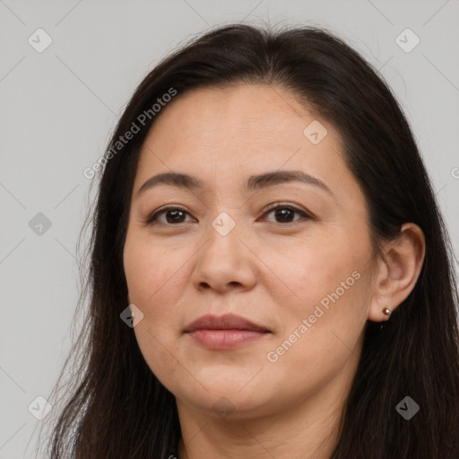 Joyful white adult female with long  brown hair and brown eyes