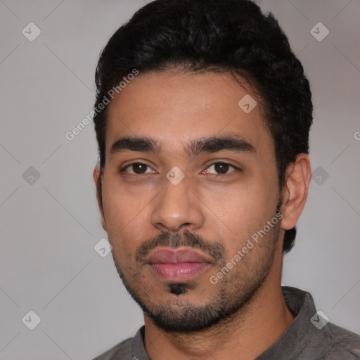 Neutral latino young-adult male with short  black hair and brown eyes