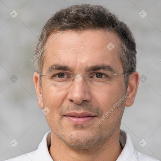 Joyful white adult male with short  brown hair and brown eyes