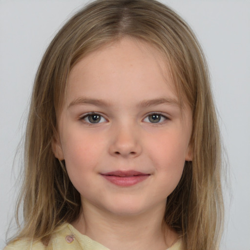 Joyful white child female with medium  brown hair and grey eyes