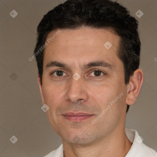 Joyful white adult male with short  black hair and brown eyes