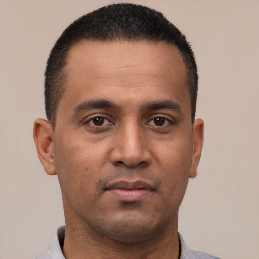 Neutral latino young-adult male with short  black hair and brown eyes