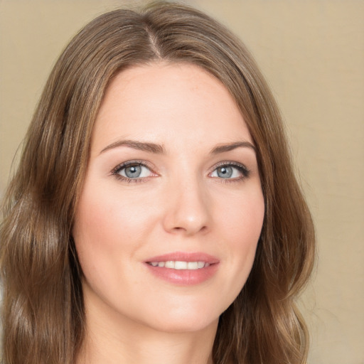 Joyful white young-adult female with long  brown hair and green eyes