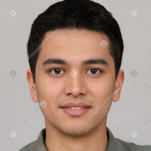 Joyful white young-adult male with short  black hair and brown eyes