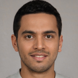 Joyful white young-adult male with short  black hair and brown eyes