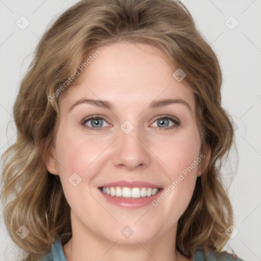 Joyful white young-adult female with medium  brown hair and blue eyes