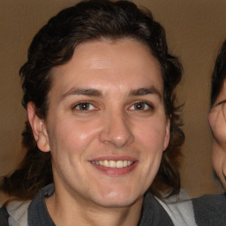 Joyful white adult male with medium  brown hair and brown eyes