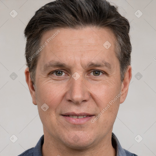 Joyful white adult male with short  brown hair and grey eyes