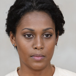 Neutral black young-adult female with short  brown hair and brown eyes