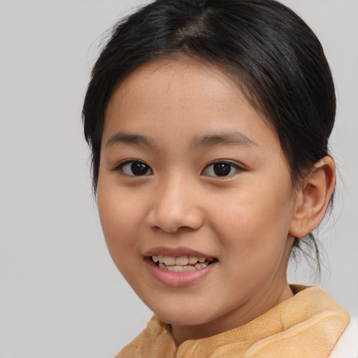 Joyful white child female with medium  brown hair and brown eyes