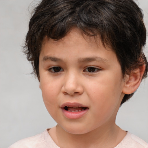 Joyful white child female with short  brown hair and brown eyes